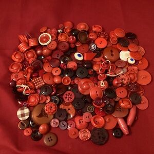 217 grams of red retro looking sewing buttons